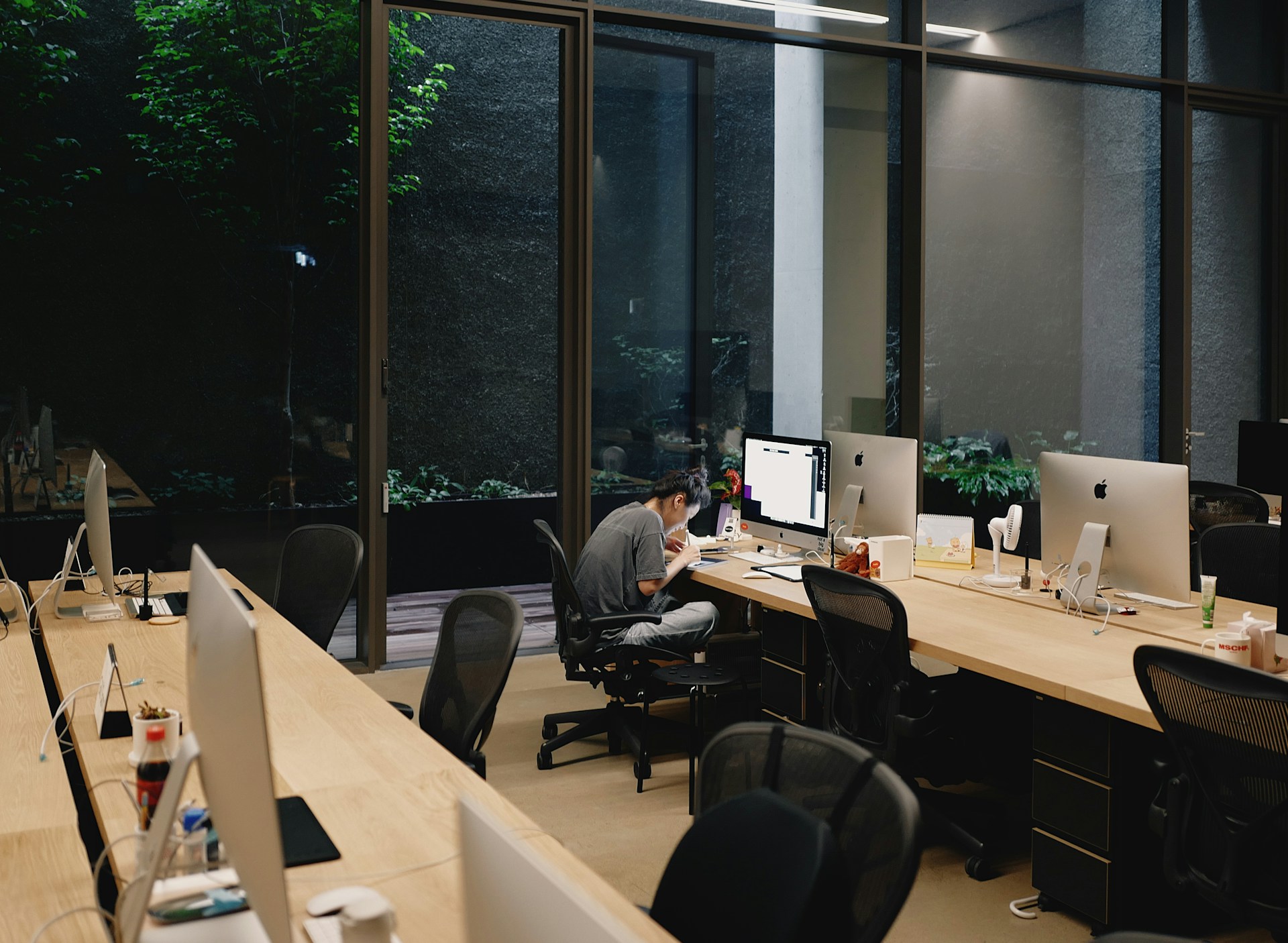 a man sitting at a desk in an office