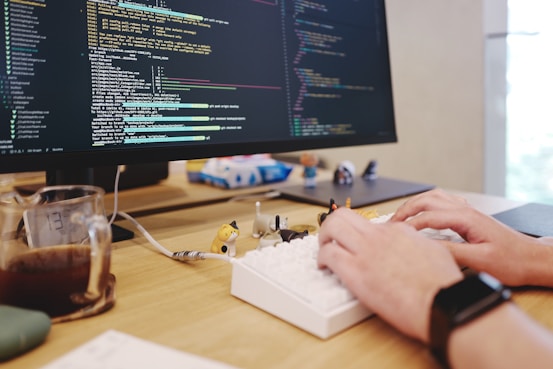 a person is typing on a computer keyboard