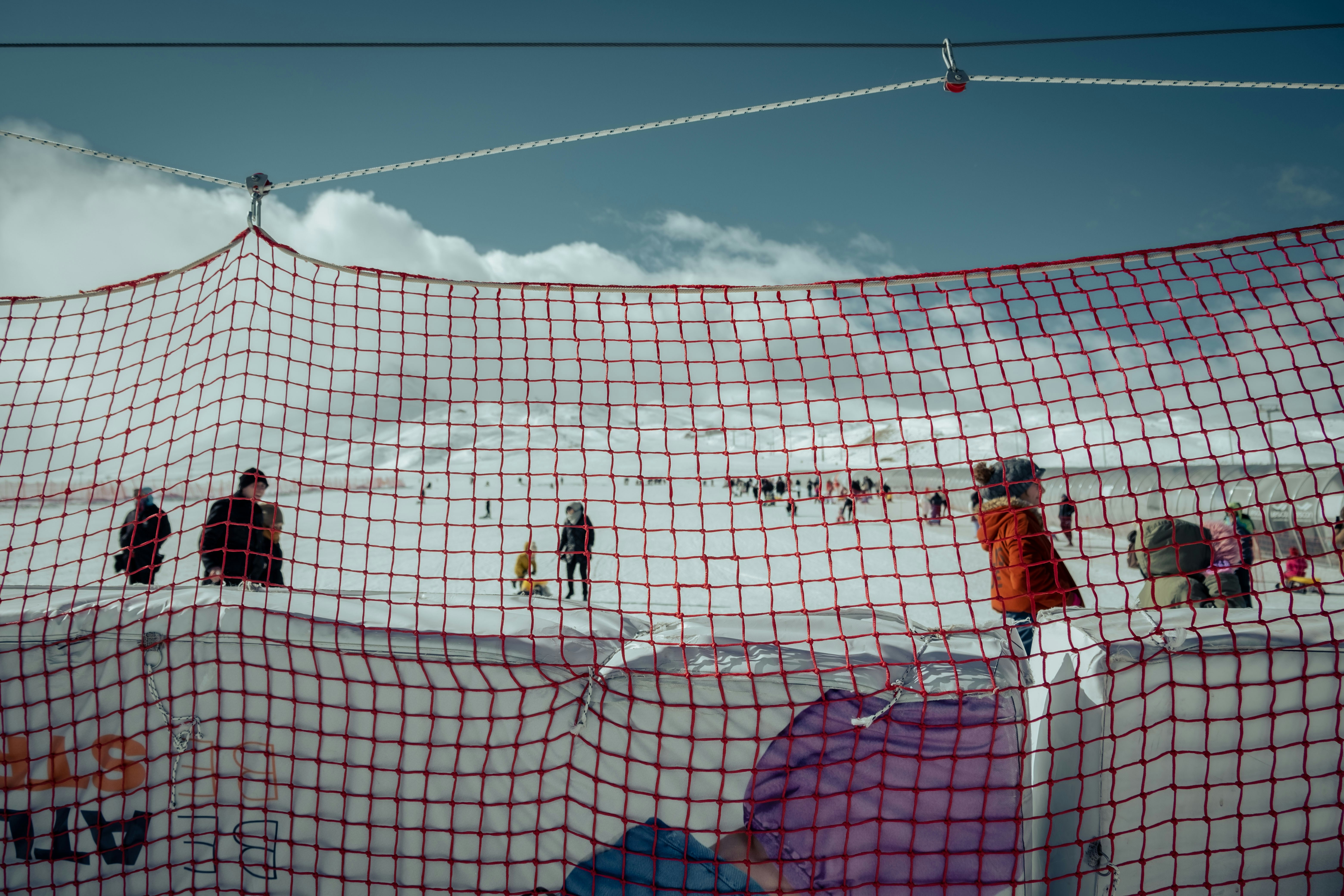 a group of people standing on top of a snow covered slope