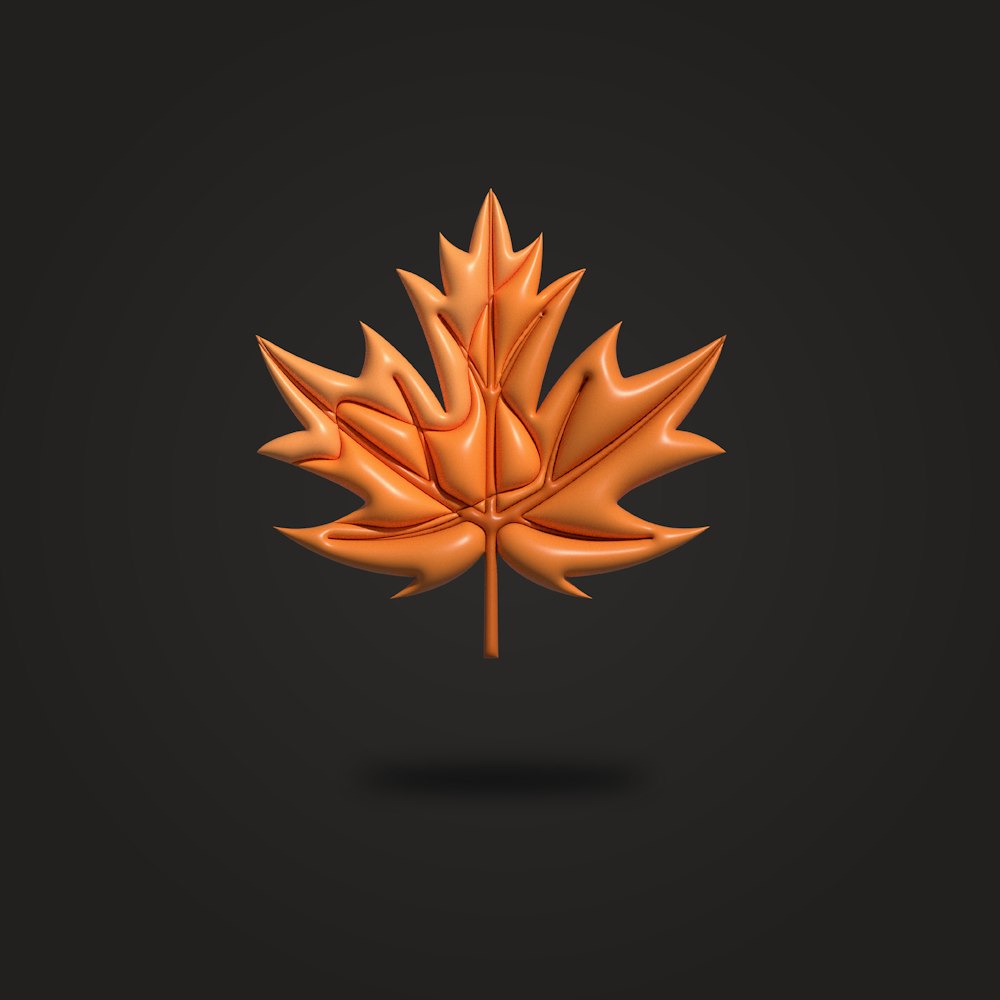 an orange maple leaf on a black background