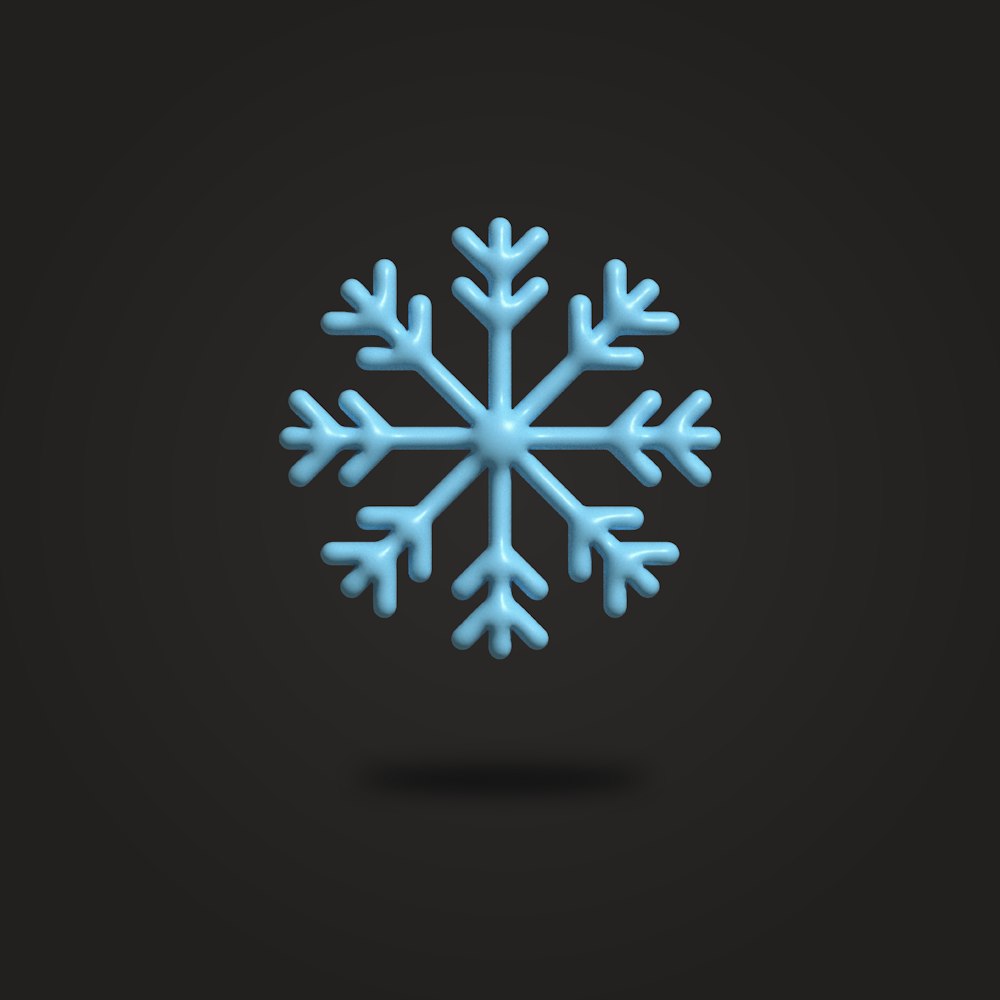 a blue snowflake on a black background