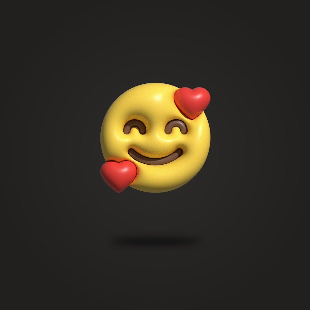 a yellow smiley face with hearts on a black background