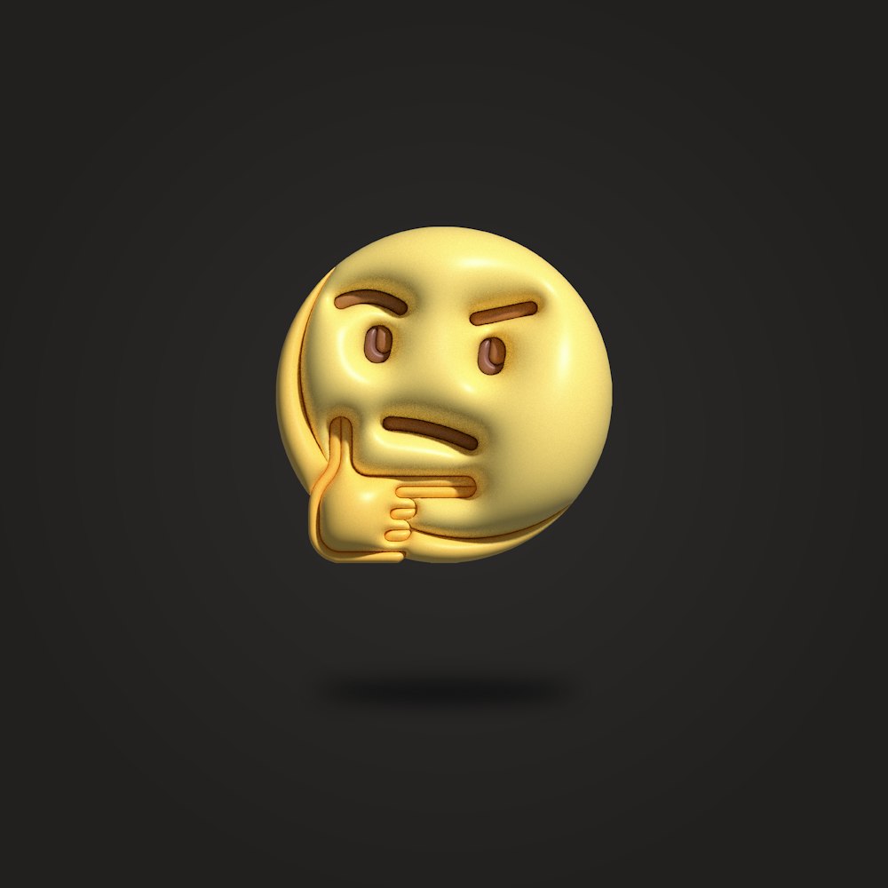 a golden emoticive smiley face on a black background