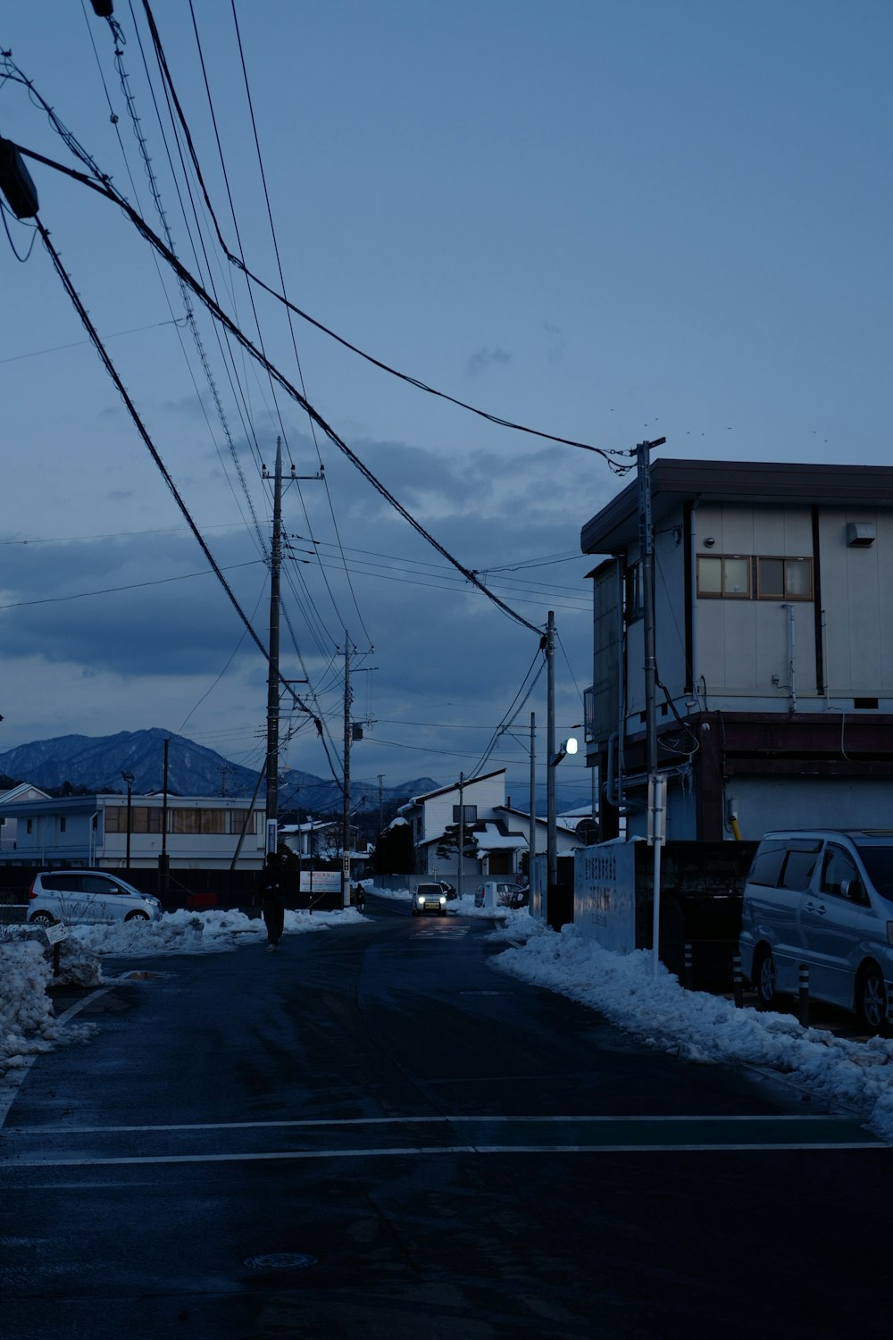 a street that has some cars parked on the side of it