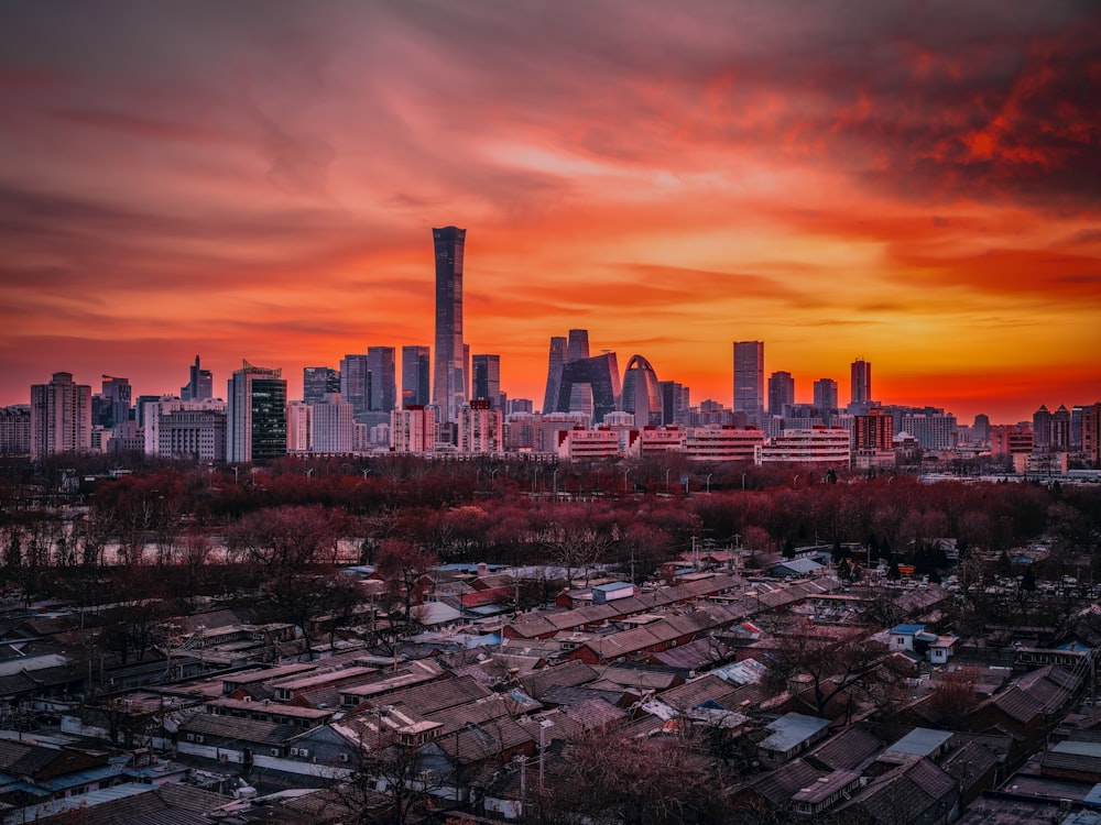 a view of a city skyline at sunset