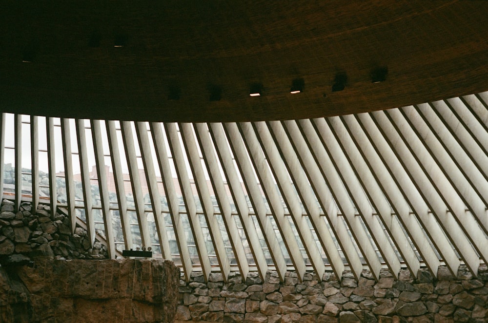 a building with a stone wall next to it