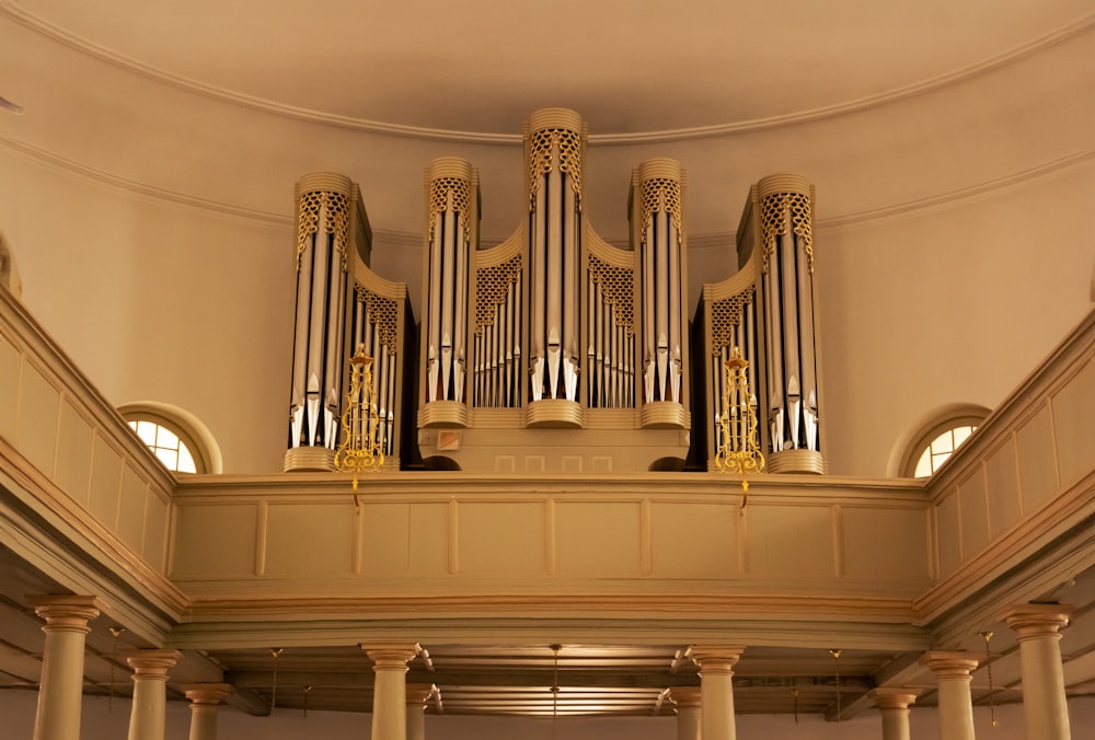 a pipe organ in a building with columns