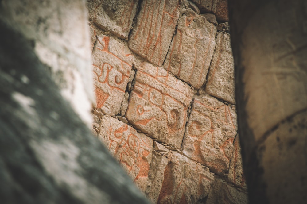 a close up of a rock with writing on it