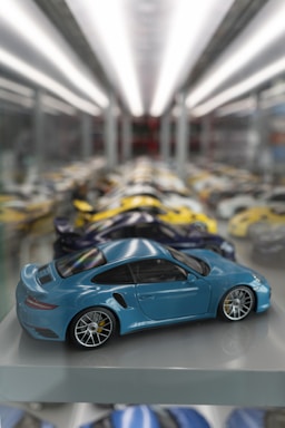 a blue toy car sitting on top of a shelf