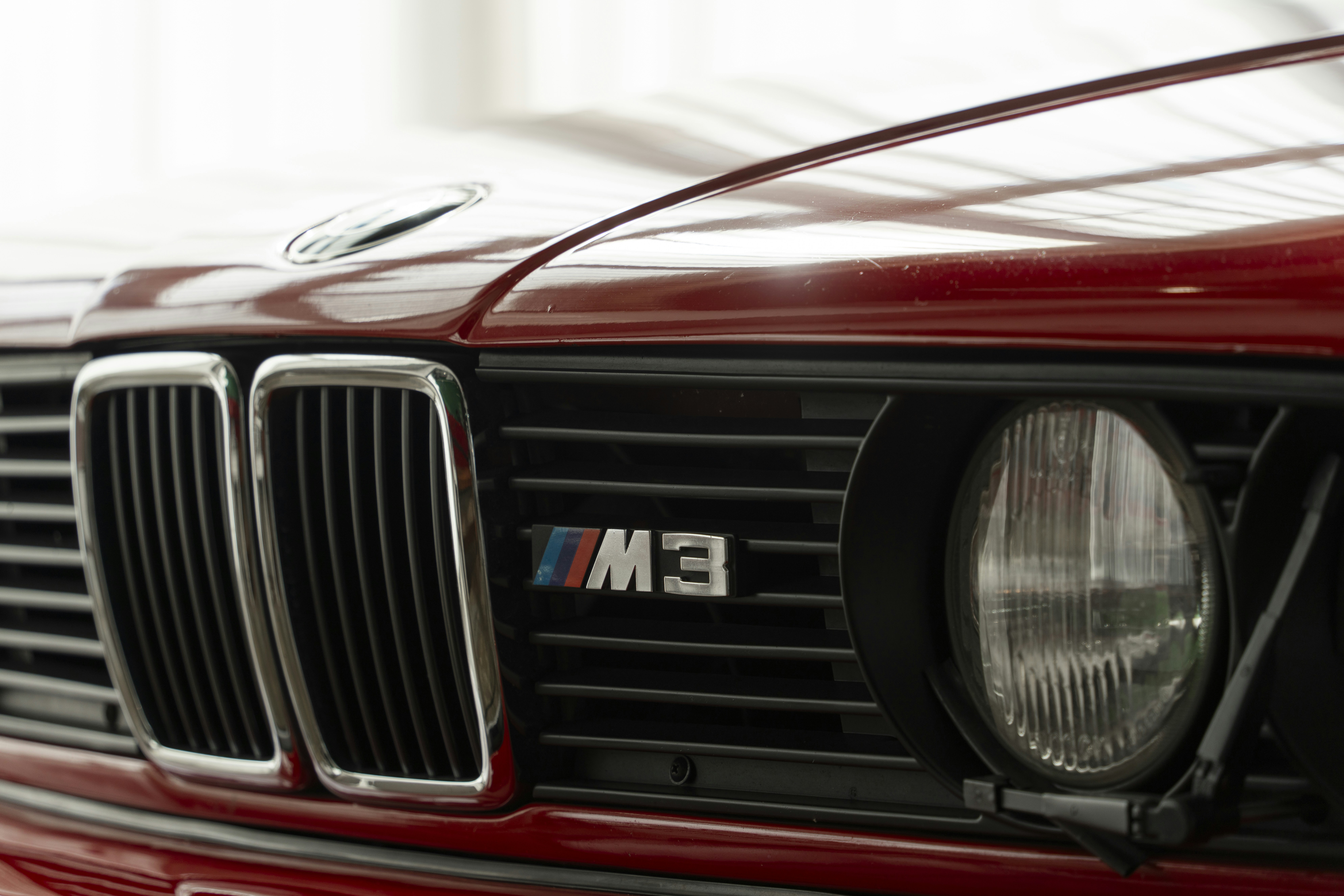 a close up of the front of a red car