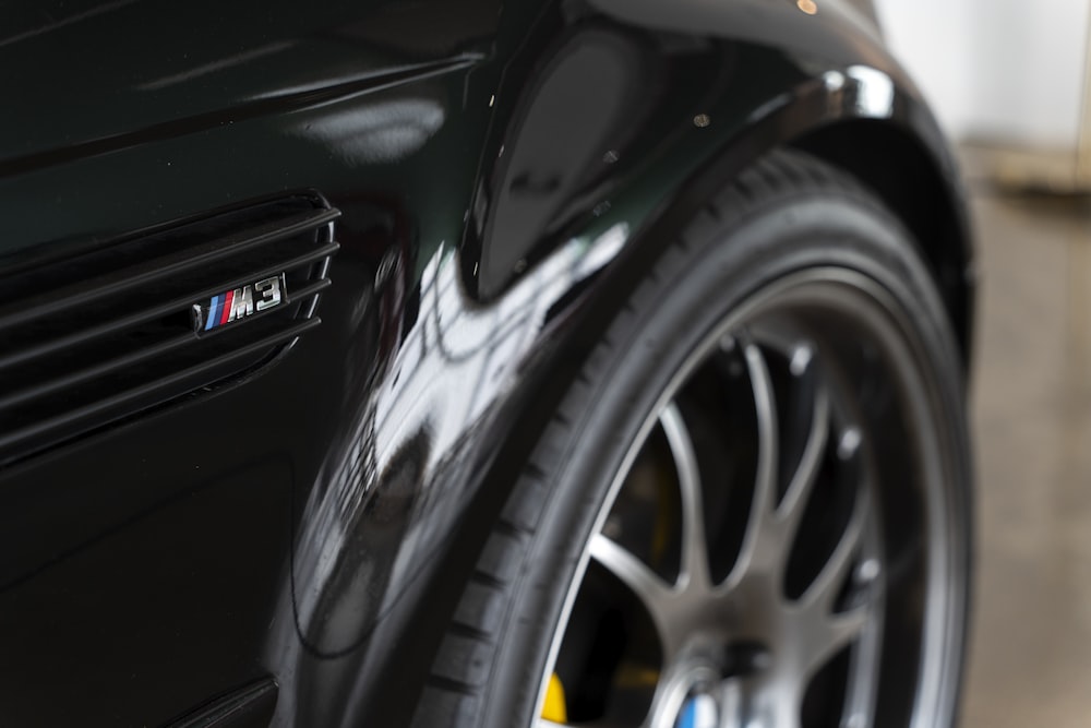 a close up of a black car tire