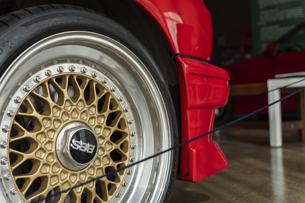 a close up of a car tire on a wooden floor