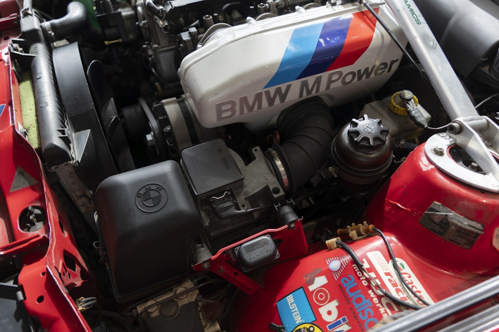 the engine compartment of a red sports car