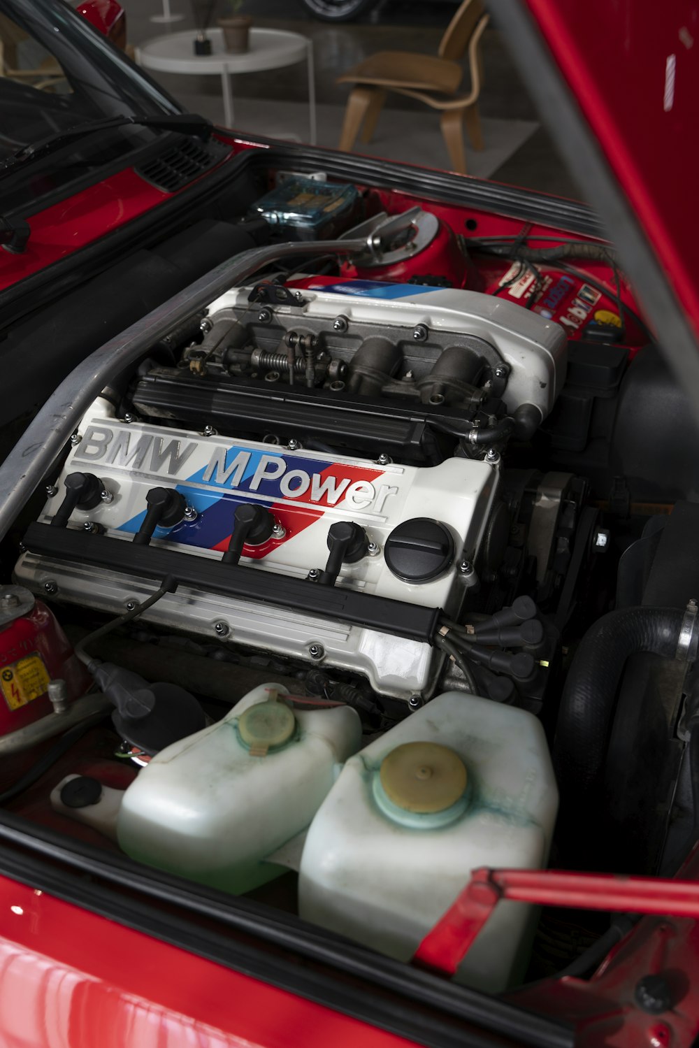 the engine compartment of a red sports car
