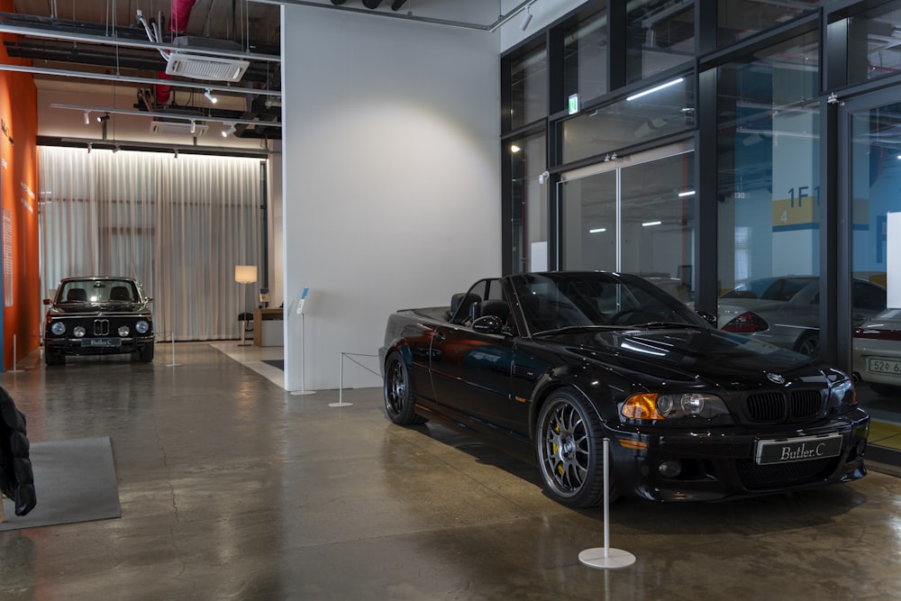 a black sports car parked in a garage