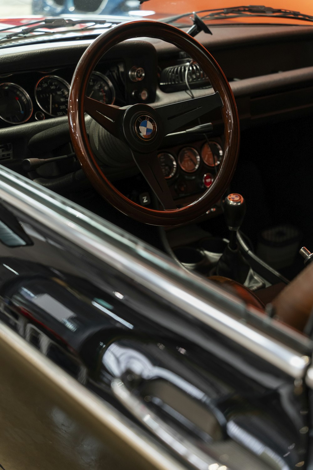 the interior of a car with a steering wheel and dashboard