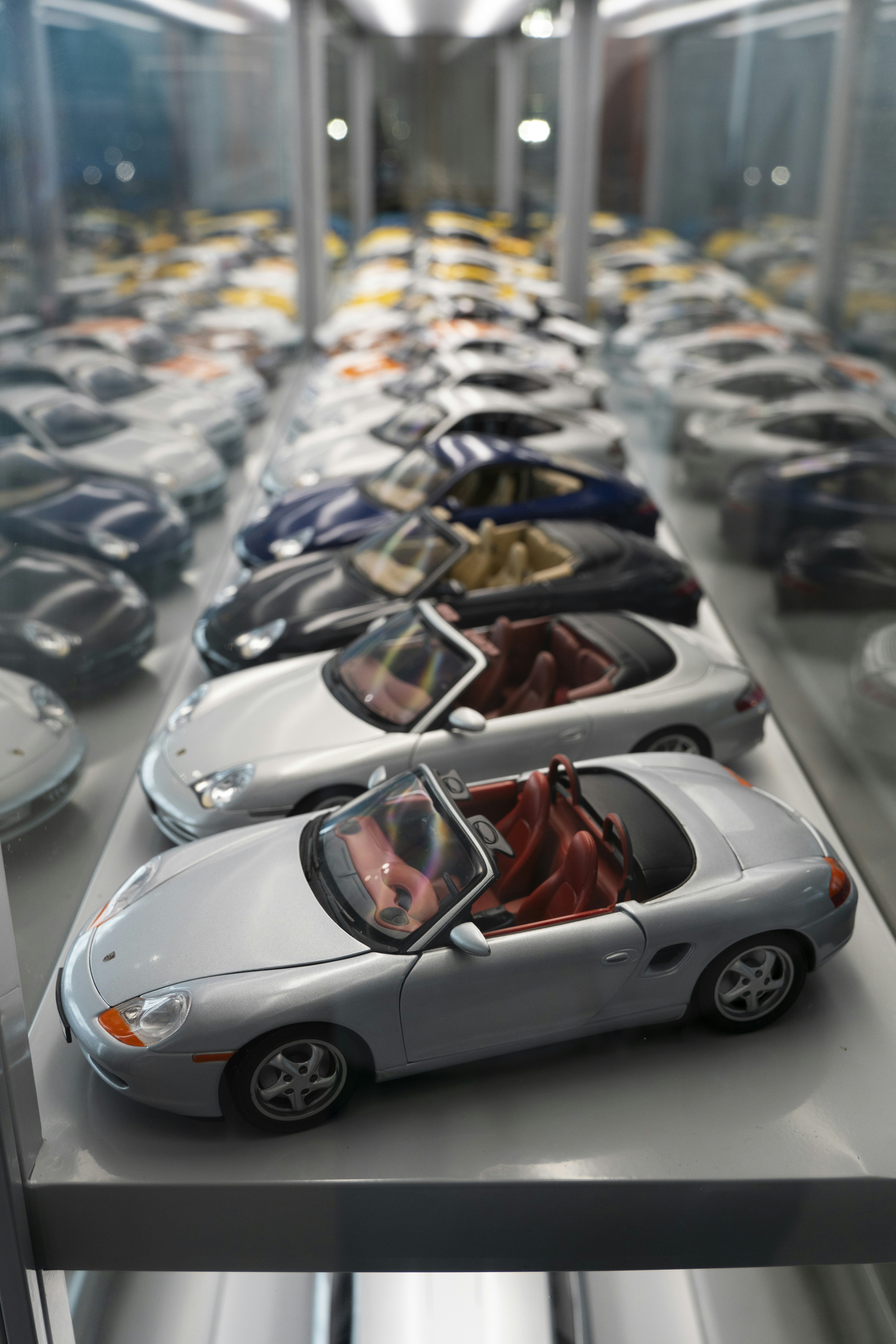a row of toy cars sitting on top of a table