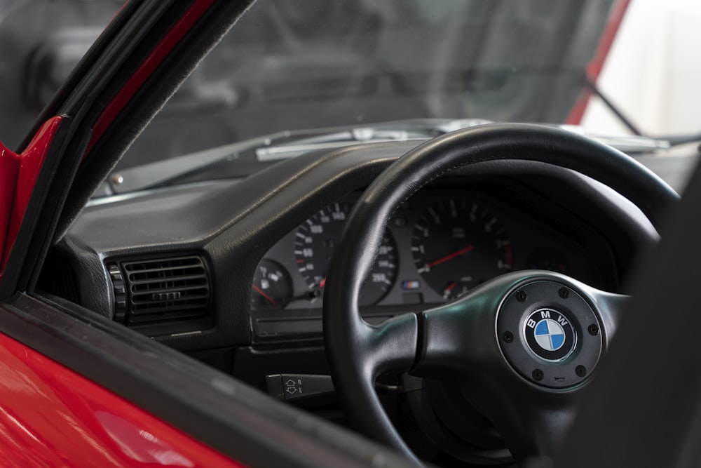 a close up of a steering wheel and dashboard of a car