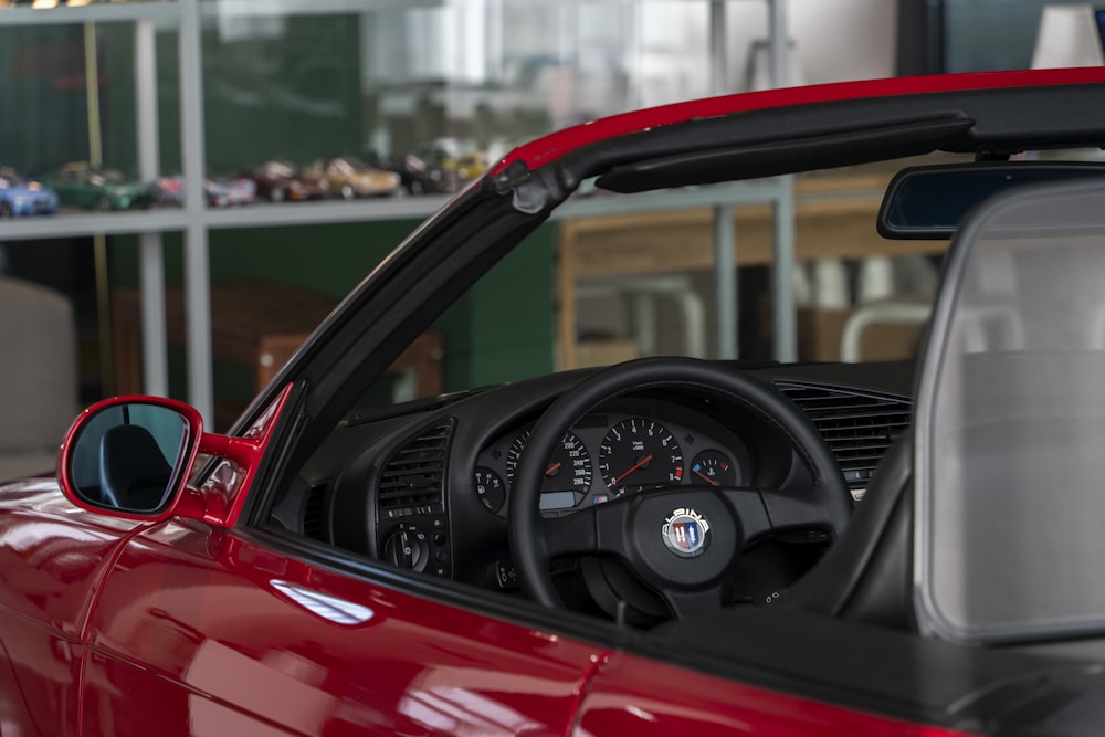 a close up of a red sports car's dashboard