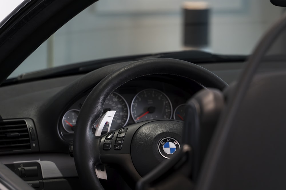 a close up of a steering wheel and dashboard of a car