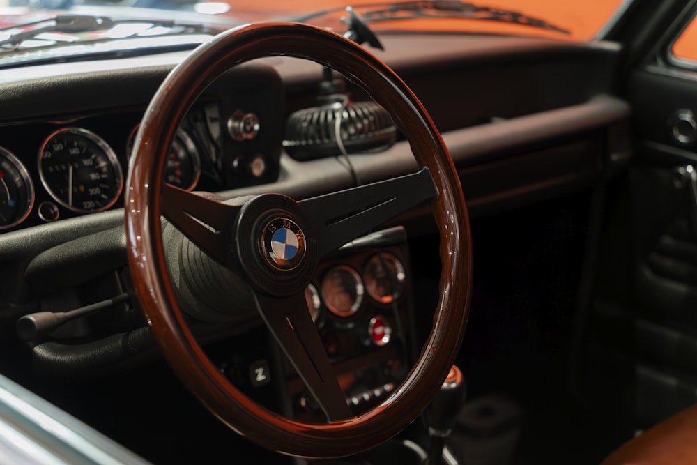 a steering wheel and dashboard of a car