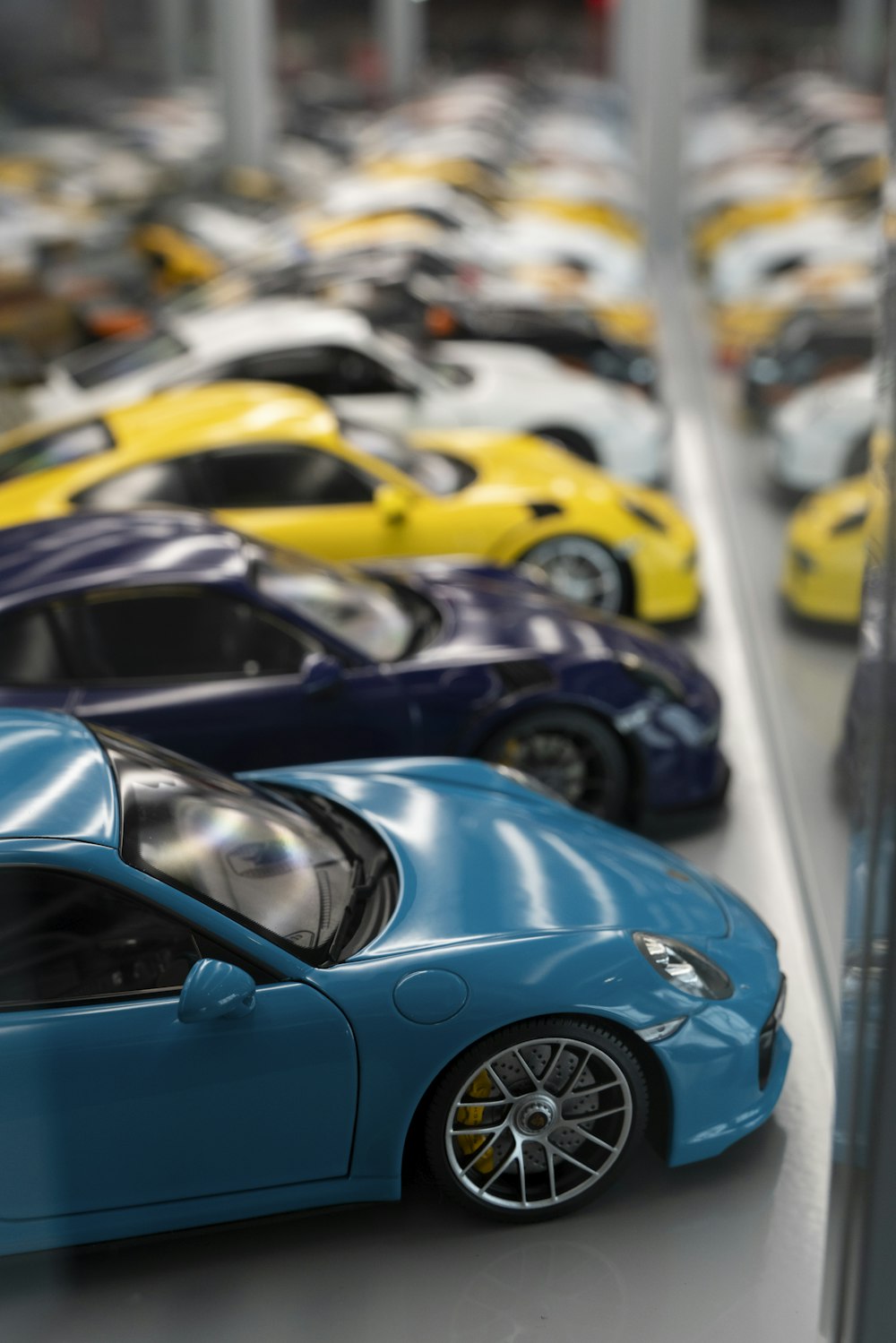 a row of toy cars sitting on top of a table