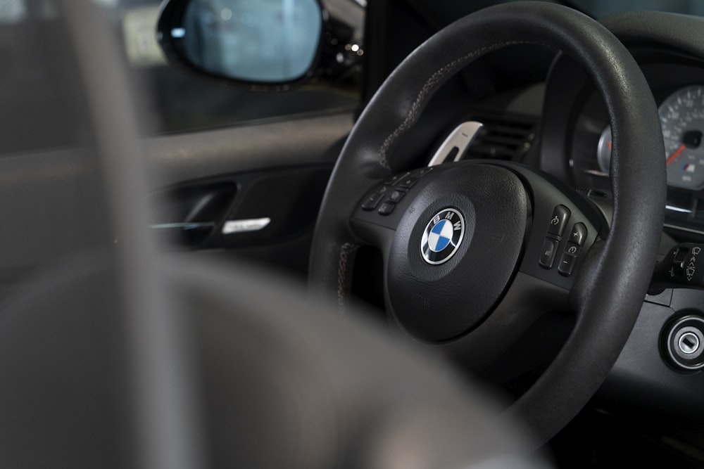 a close up of a steering wheel of a car