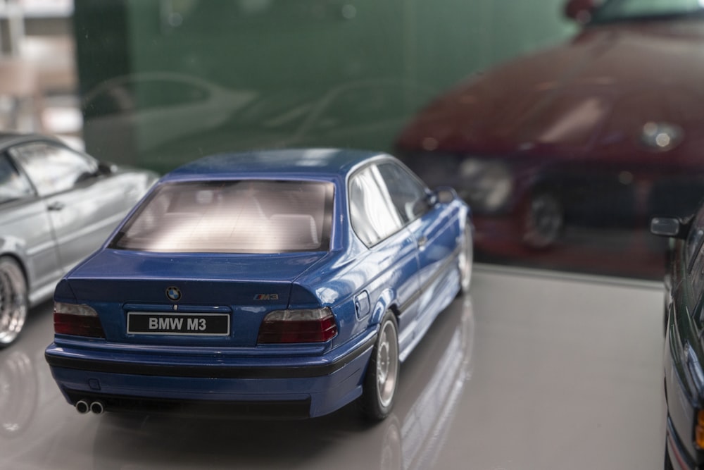 a couple of toy cars sitting on top of a table