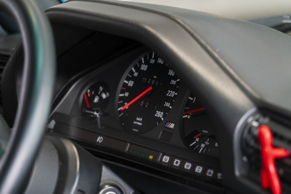 a close up of a speedometer in a car