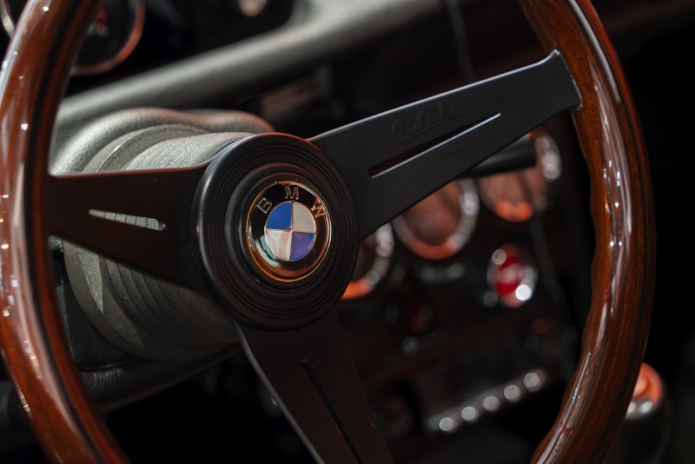 a close up of a steering wheel and dashboard of a car