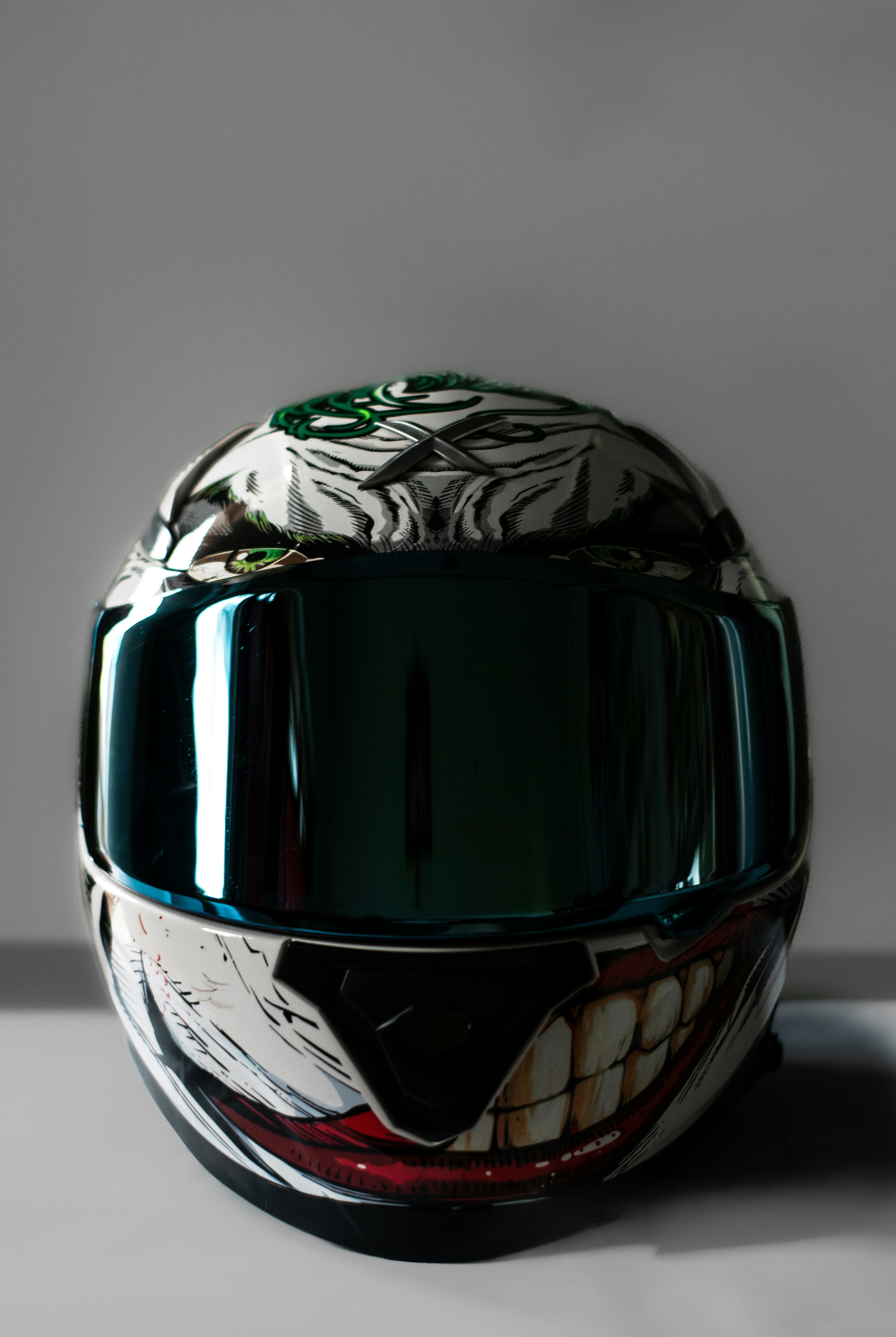 a green helmet with a tiger design on it