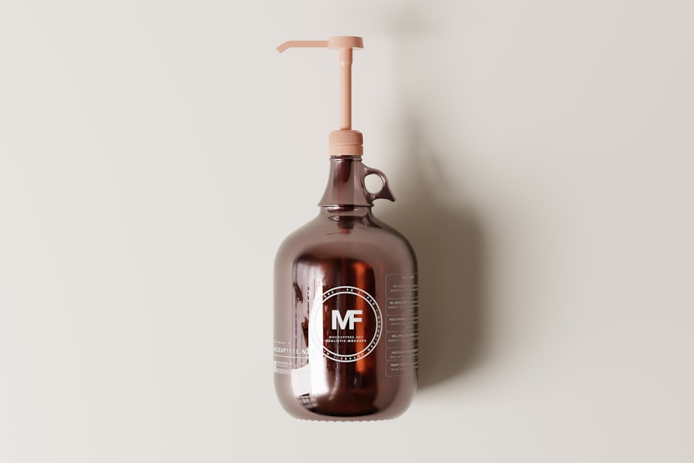 a brown bottle hanging from a hook on a wall