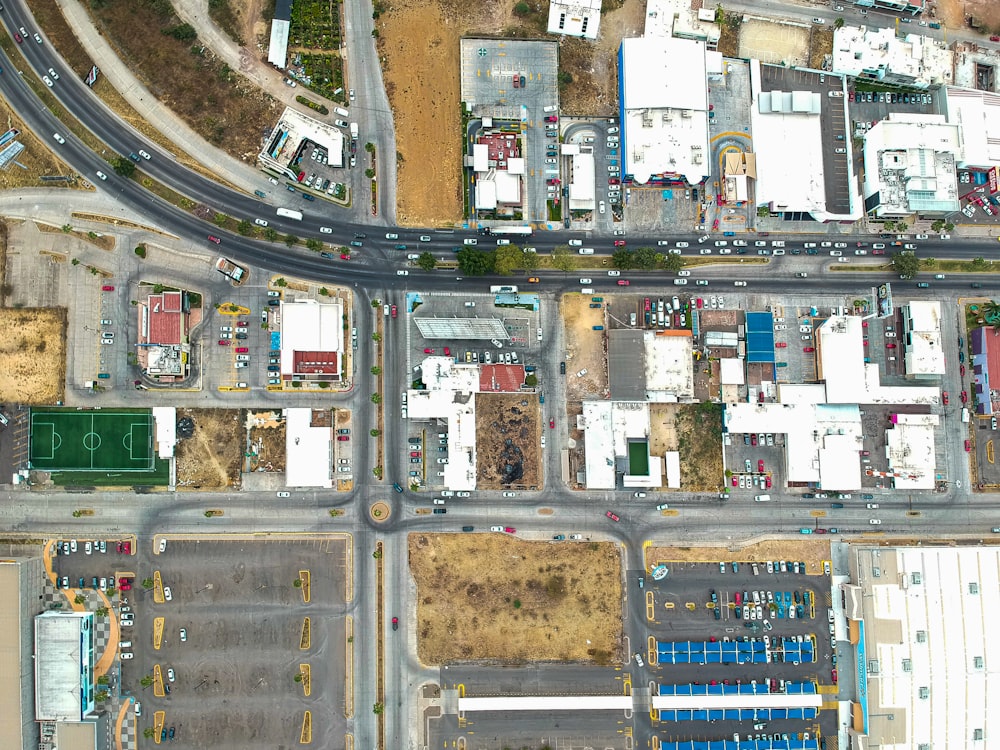 an aerial view of a street intersection with cars