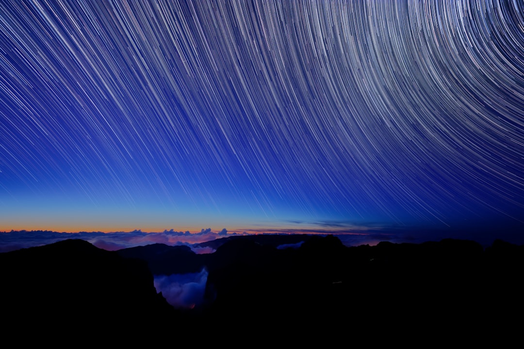 Taken shortly after sunset the image shows star trails over the mountains of Madeira with storm clouds below.
