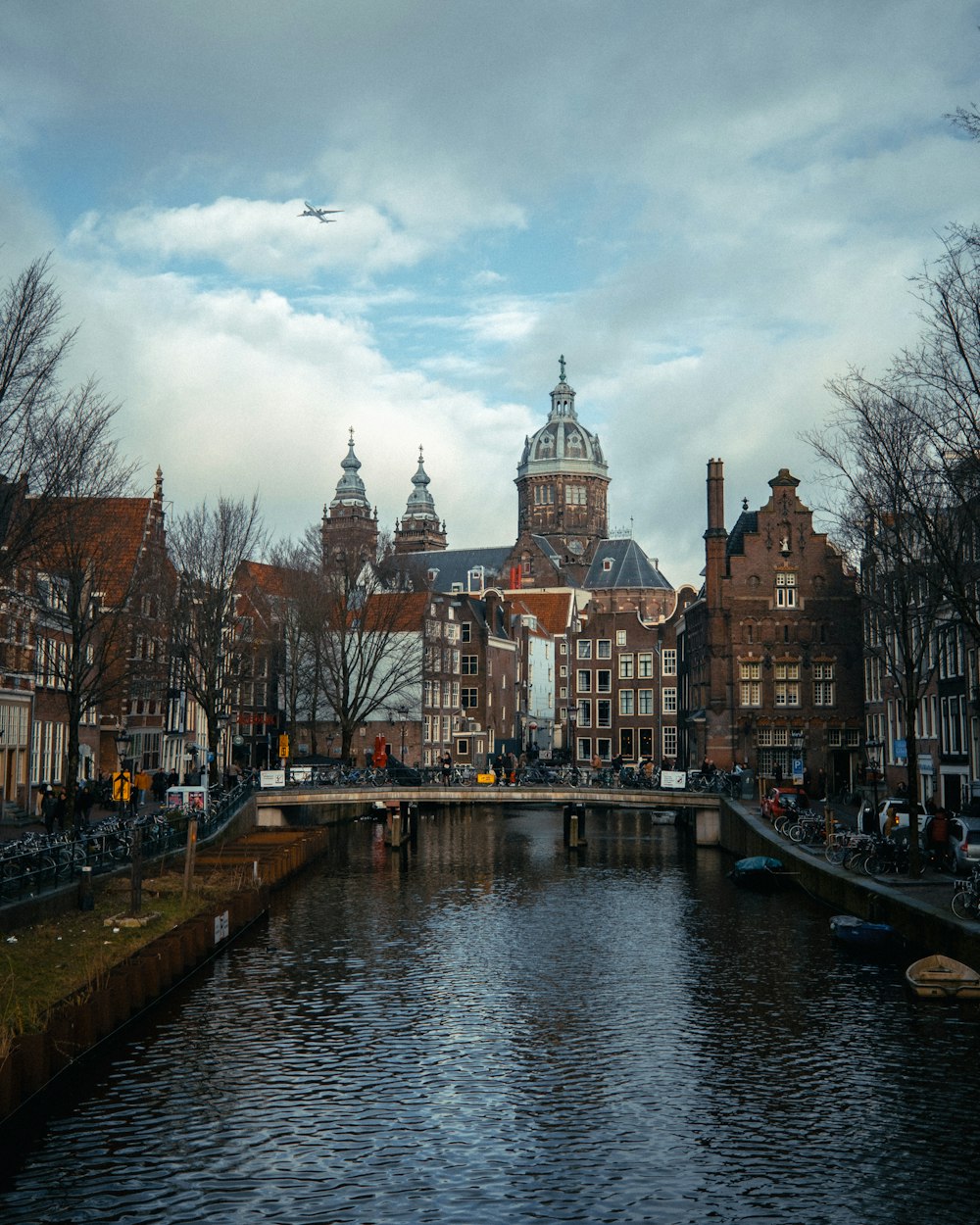 a river running through a city next to tall buildings