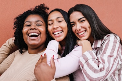 a group of women standing next to each other