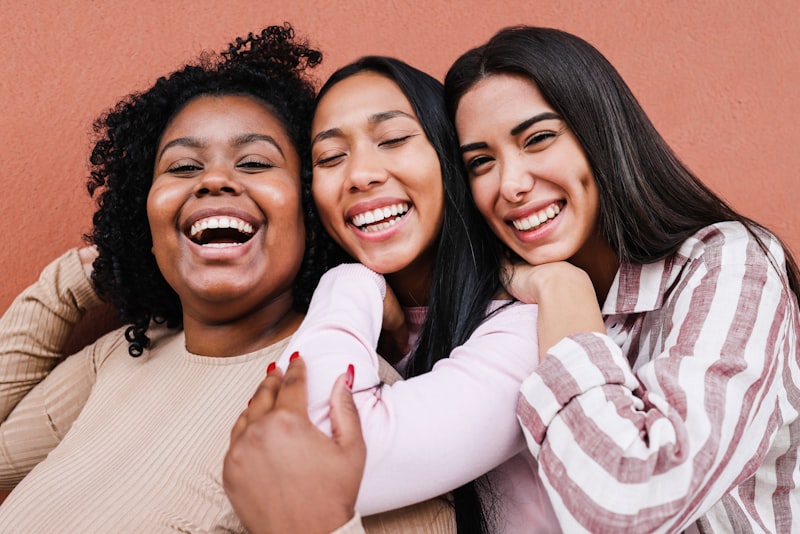 A group of women gathered together in person