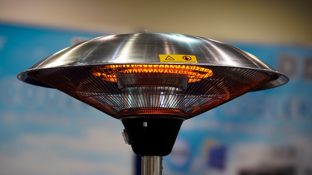 a close up of a heater with a blue background