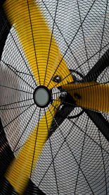 a close up of a yellow and black fan