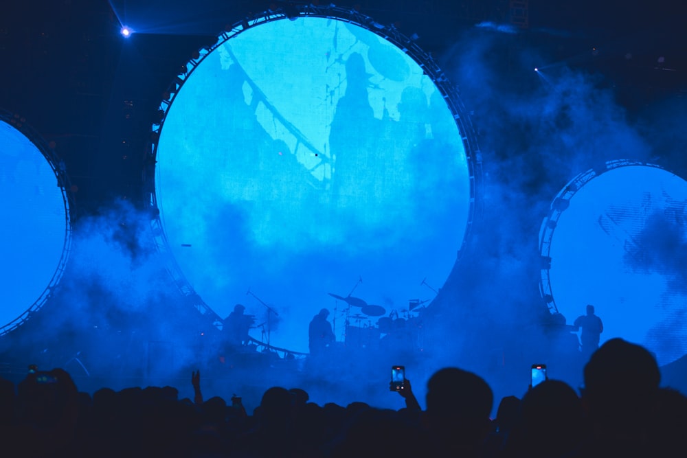 a group of people standing on top of a stage