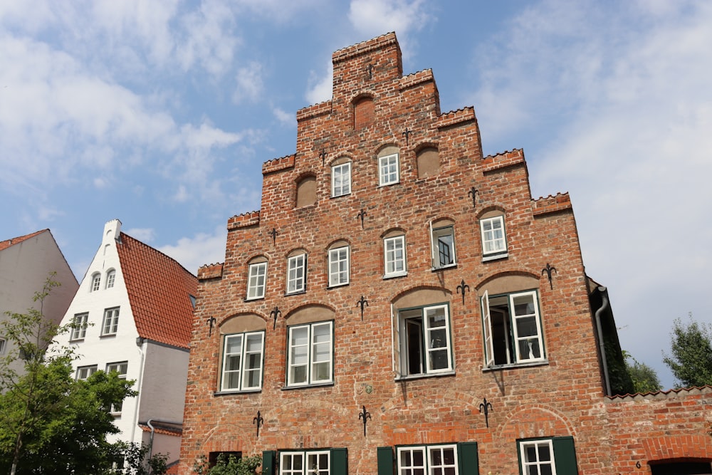 a tall brick building with many windows