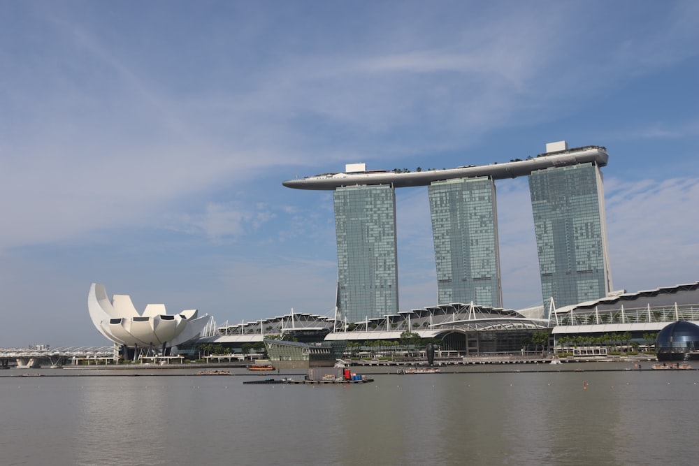 a large body of water next to tall buildings