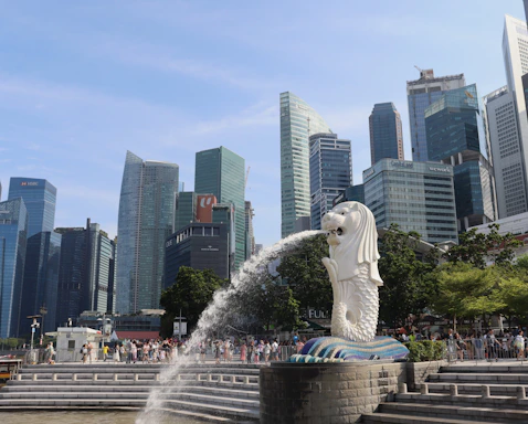 a statue of a woman spewing water into the air