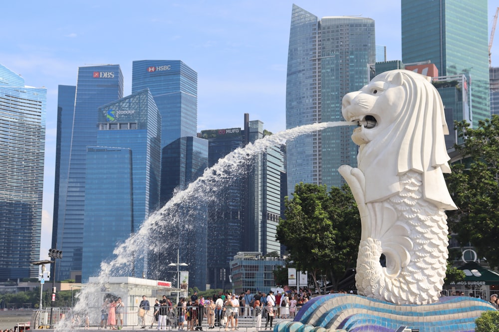 a statue of a lion spewing water into the air