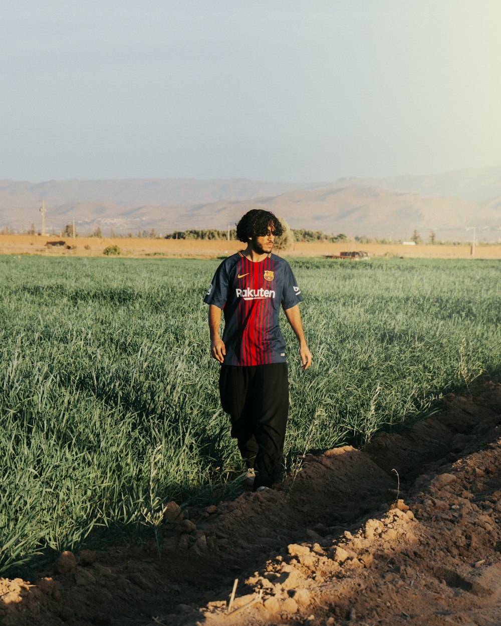 a man standing in the middle of a field