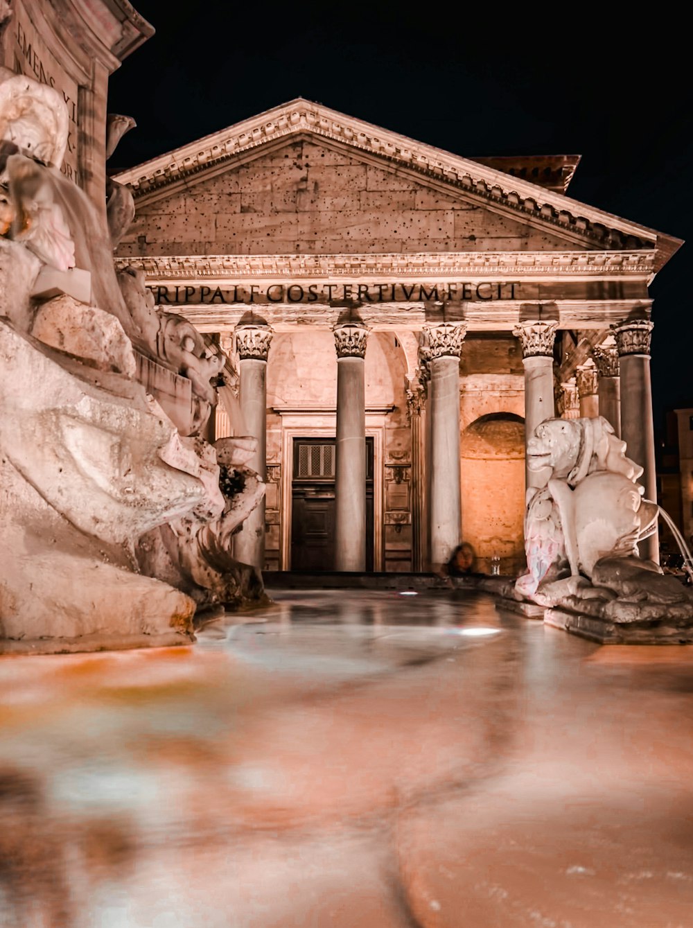 a building with a fountain in front of it