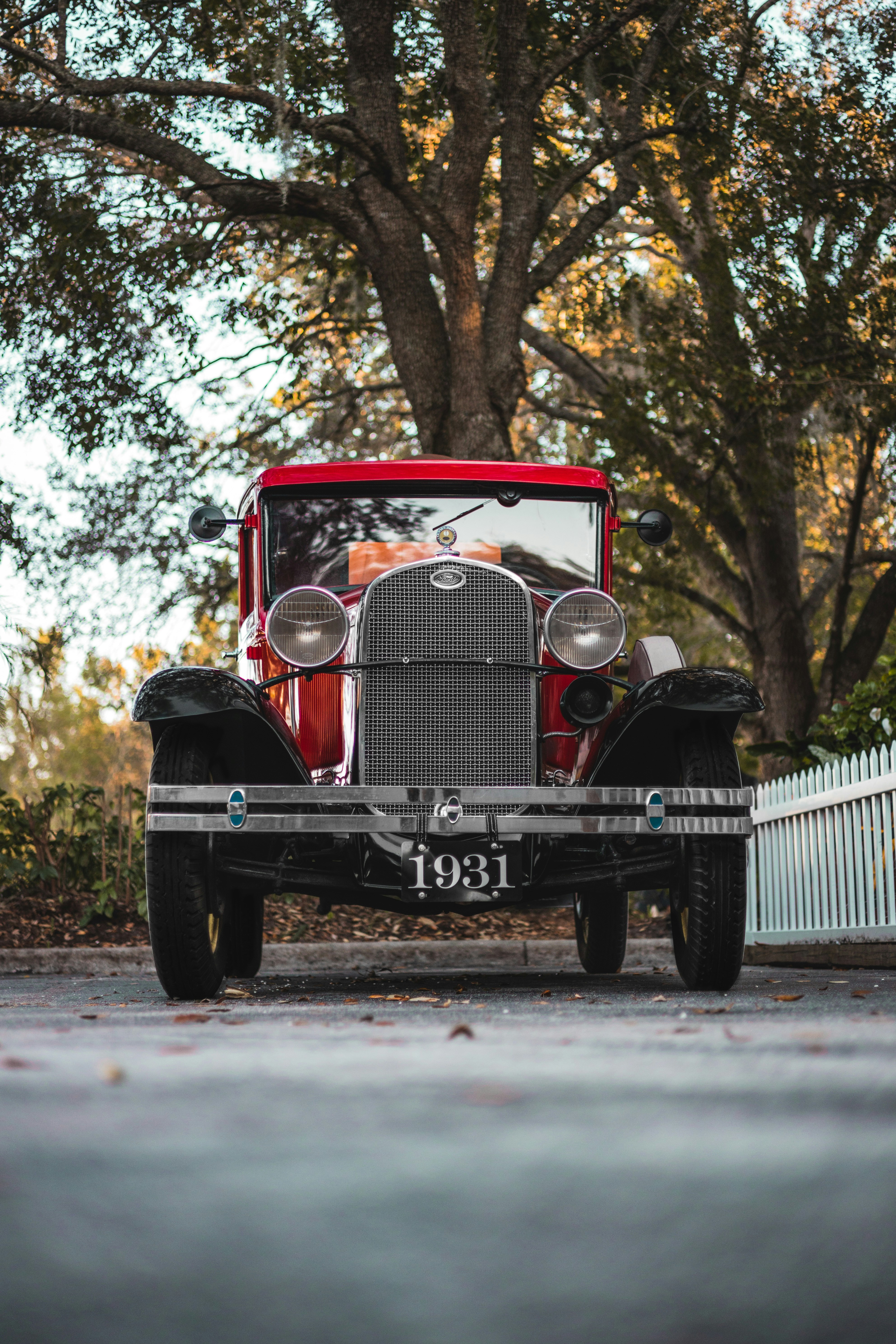 a vintage car parked on the side of the road