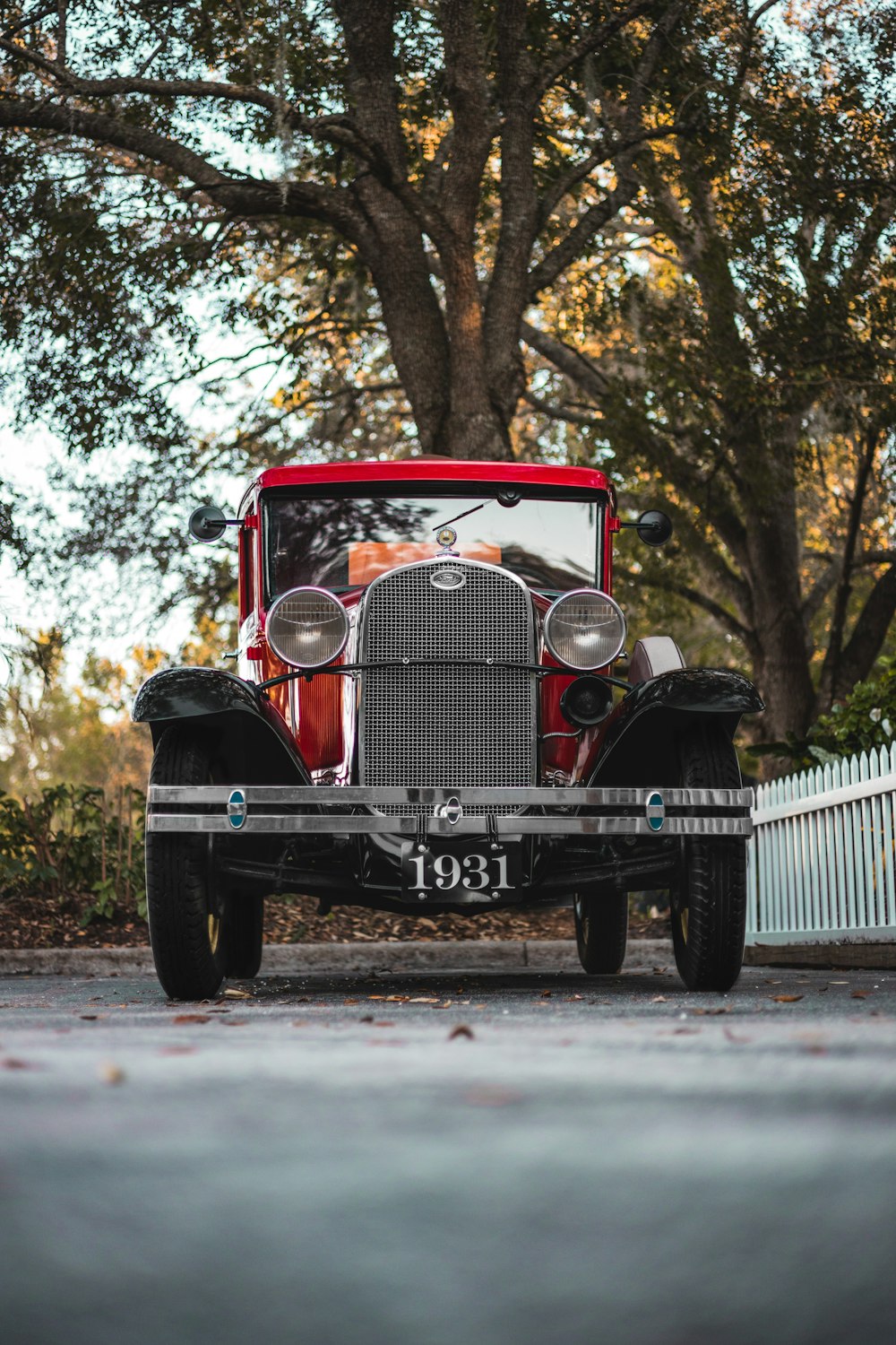 a vintage car parked on the side of the road