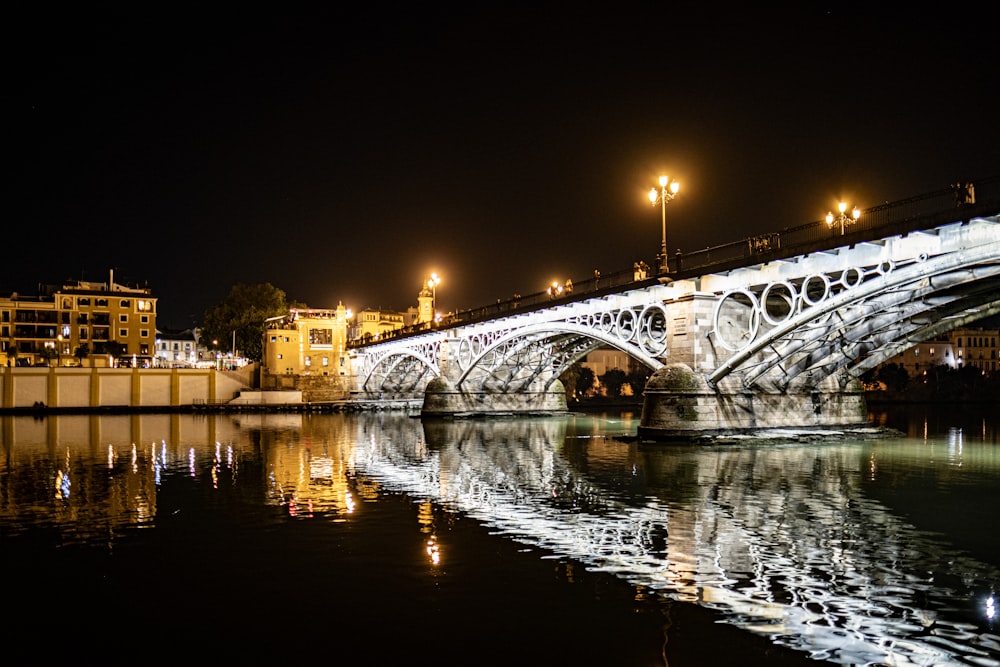 a bridge over a body of water at night