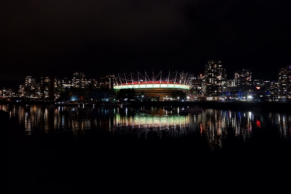 a night view of a city and a body of water